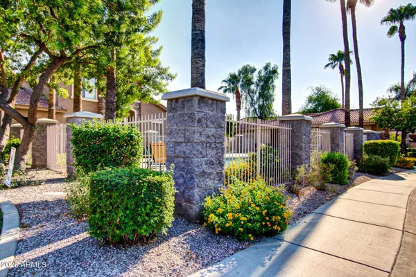 a view of a house with backyard porch and sitting area