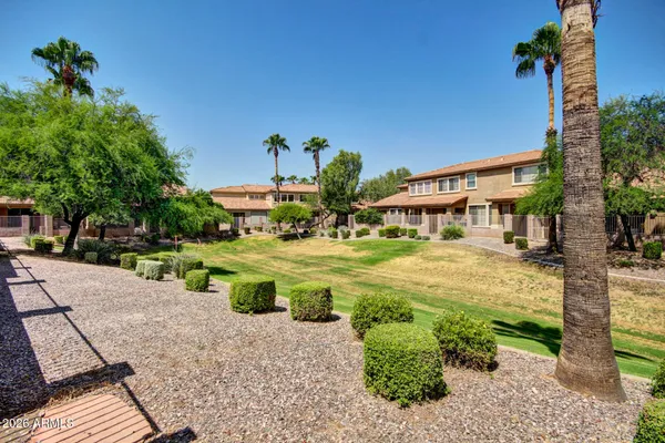a view of a swimming pool with a patio and a patio