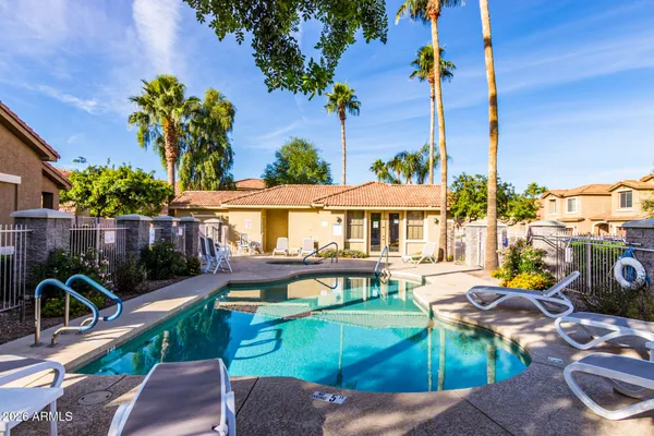 a green field with lots of flower plants
