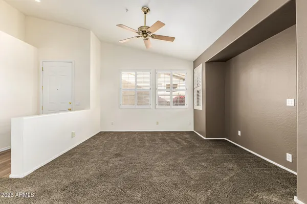 a view of an empty room with a window