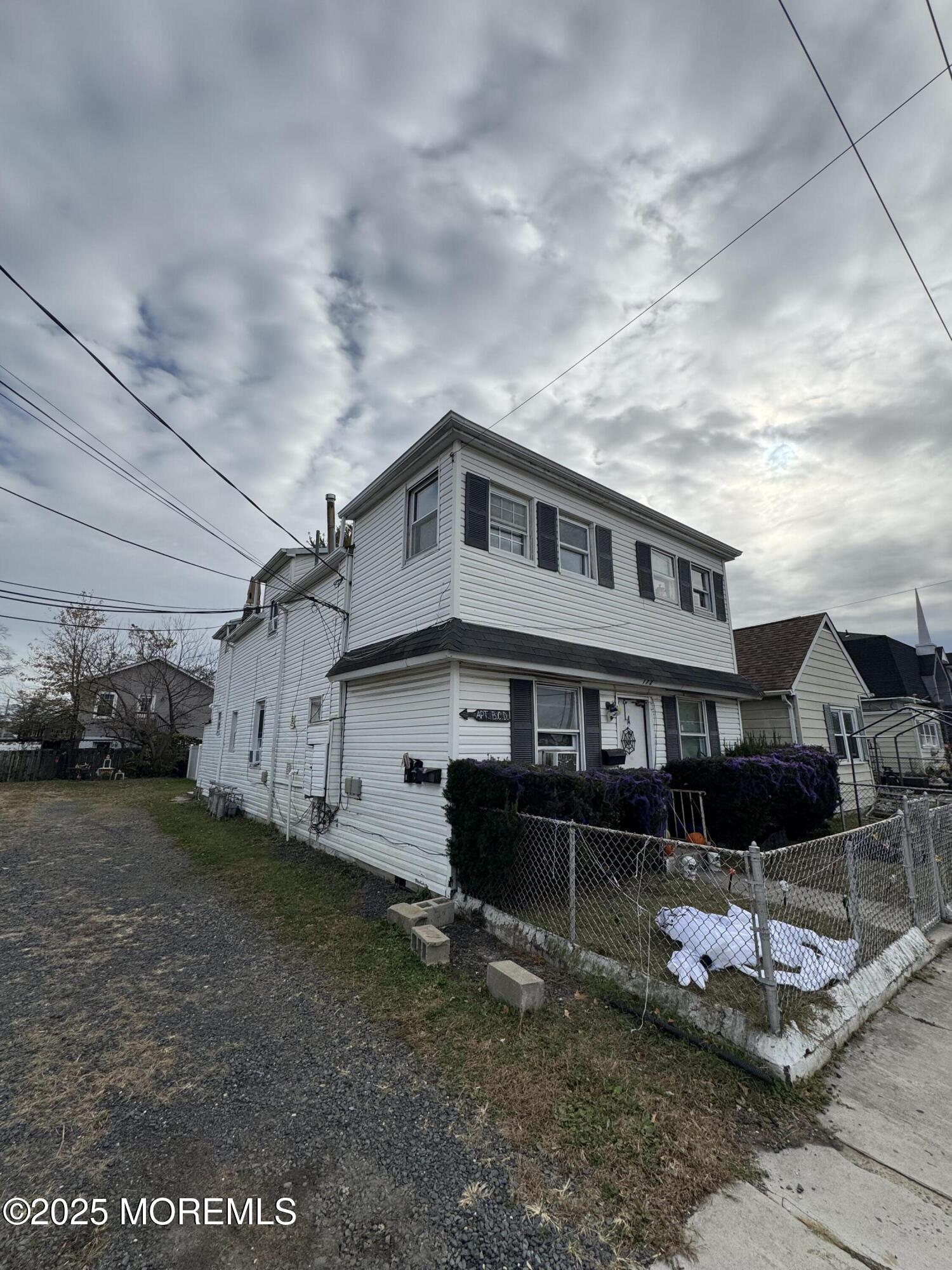 172 Carr Avenue, Unit D Keansburg, NJ 07734 - Photo 1 of 12 a front view of a house with a yard