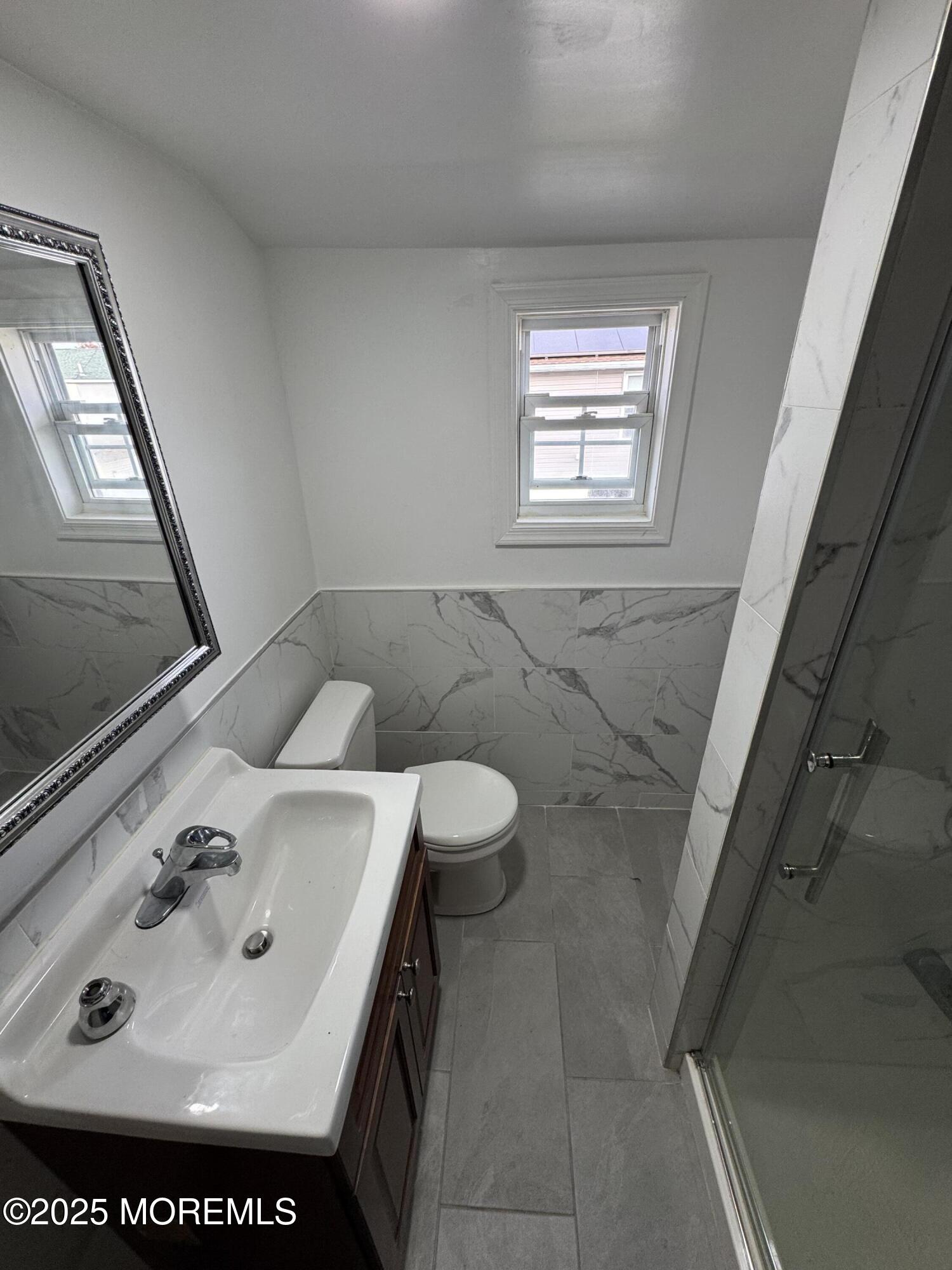 172 Carr Avenue, Unit D Keansburg, NJ 07734 - Photo 8 of 12 a bathroom with a sink and a mirror