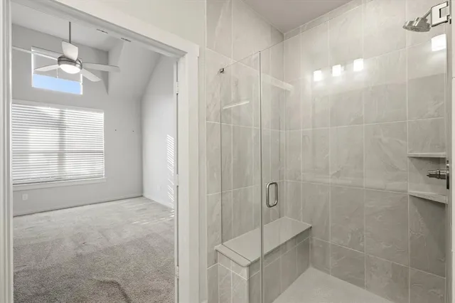 a bathroom with a shower and a sink