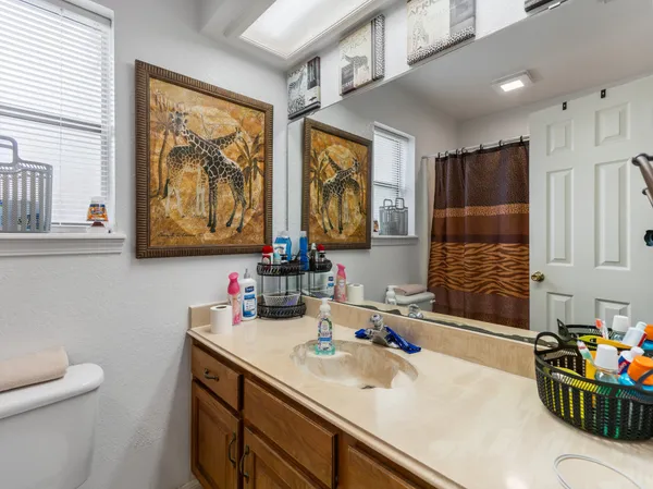 a bathroom with a sink double vanity and a shower