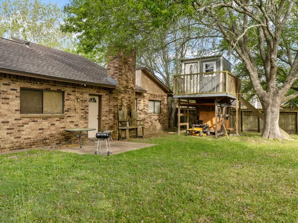 a view of a house with a yard porch and sitting area