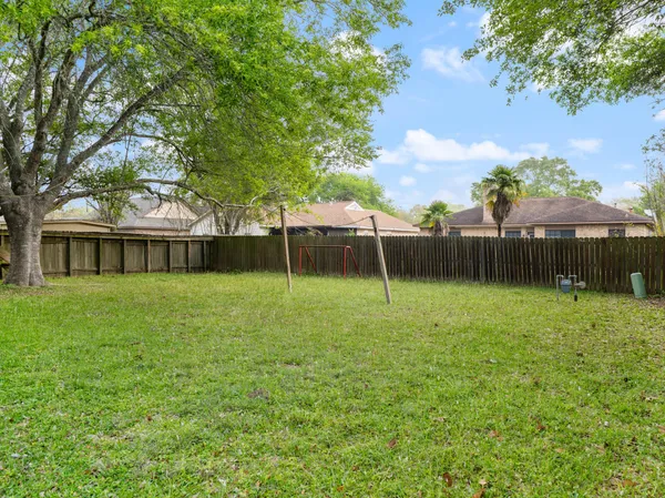 a backyard of a house with lots of green space