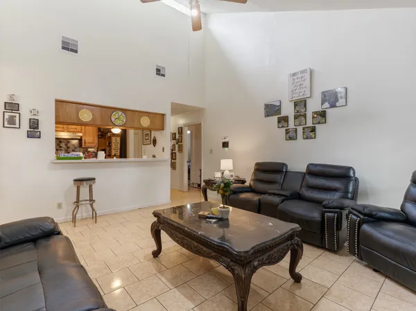 a living room with furniture and a table