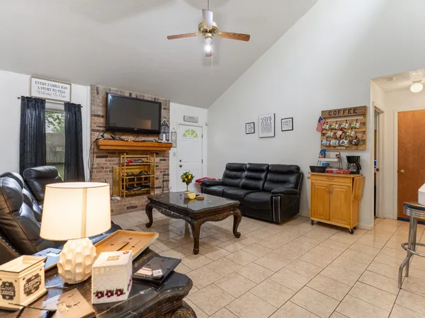 a living room with furniture and a flat screen tv