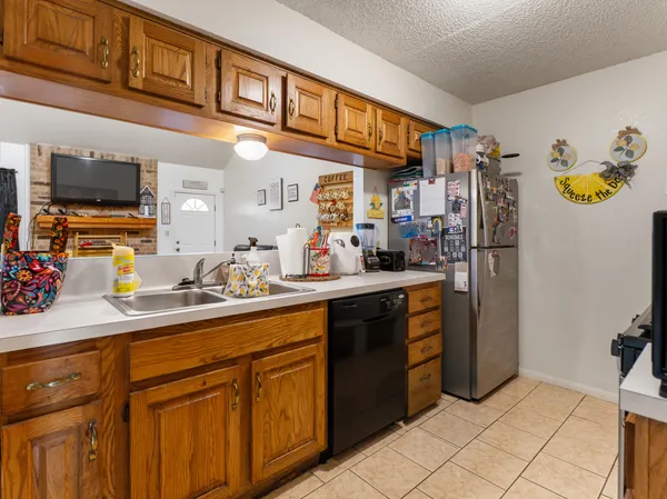 a kitchen with a sink cabinets and window