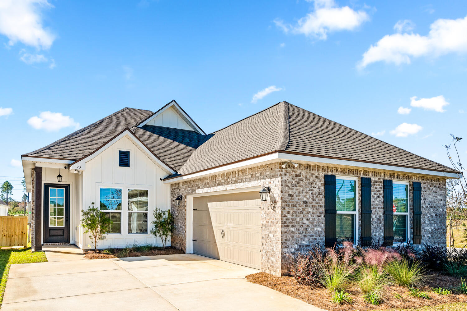 a front view of a house with large windows