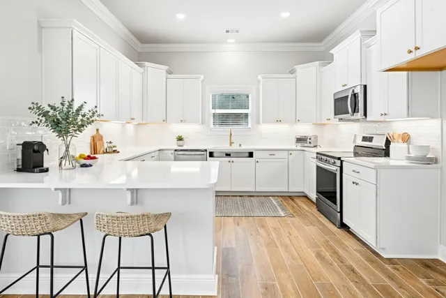 a kitchen with a sink cabinets and window