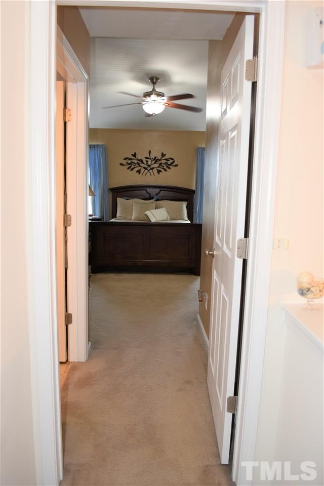 351 Gilman Lane, Unit 102 Raleigh, NC 27610 - Photo 14 of 18 Entering the resort style suite! Are you ready for rest and relaxation. Master bath is to the left.