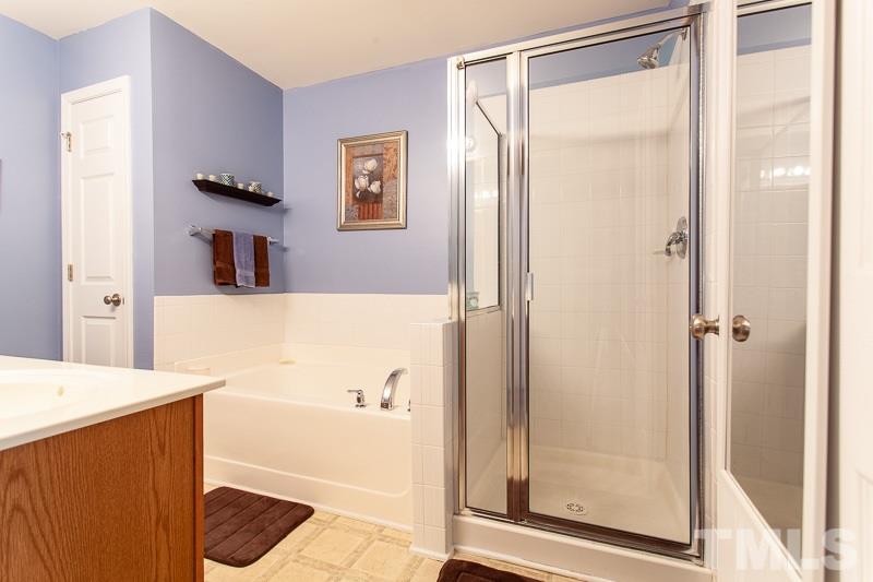 351 Gilman Lane, Unit 102 Raleigh, NC 27610 - Photo 15 of 18 Large master bath with linen closet. You oasis from a long day at work. You can enjoy a nice candle lit bath and a book or a hot shower to wash away the weight of the day.