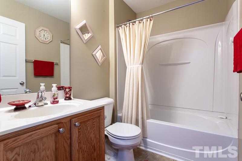 351 Gilman Lane, Unit 102 Raleigh, NC 27610 - Photo 9 of 18 Large full bath with a tub/shower. Perfect for your guests or children.