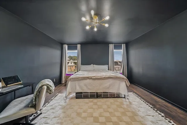 a bedroom with a bed and ceiling fan