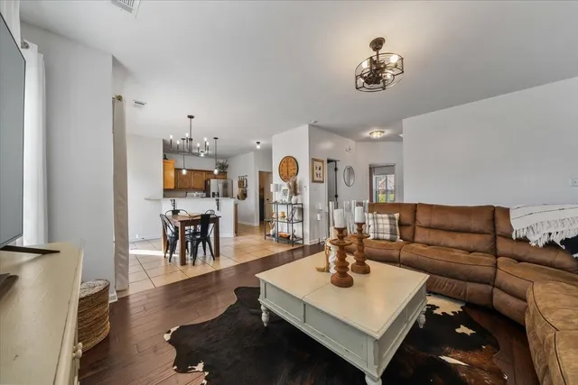 a living room with furniture and a table