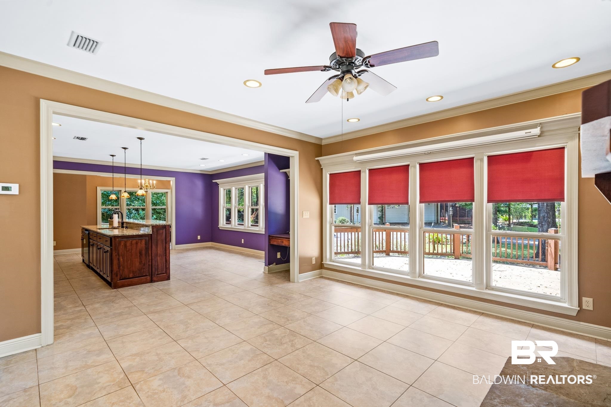 8321 Dixon Road Bay Minette, AL 36507 - Photo 32 of 79 Unfurnished living room featuring ornamental molding, light tile patterned floors, ceiling fan, and a wealth of natural light