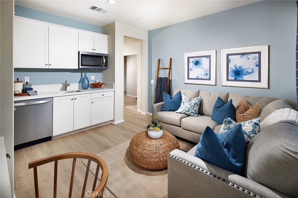 2090 El Nido Avenue Perris, CA 92571 - Photo 16 of 19 a living room with furniture and kitchen view