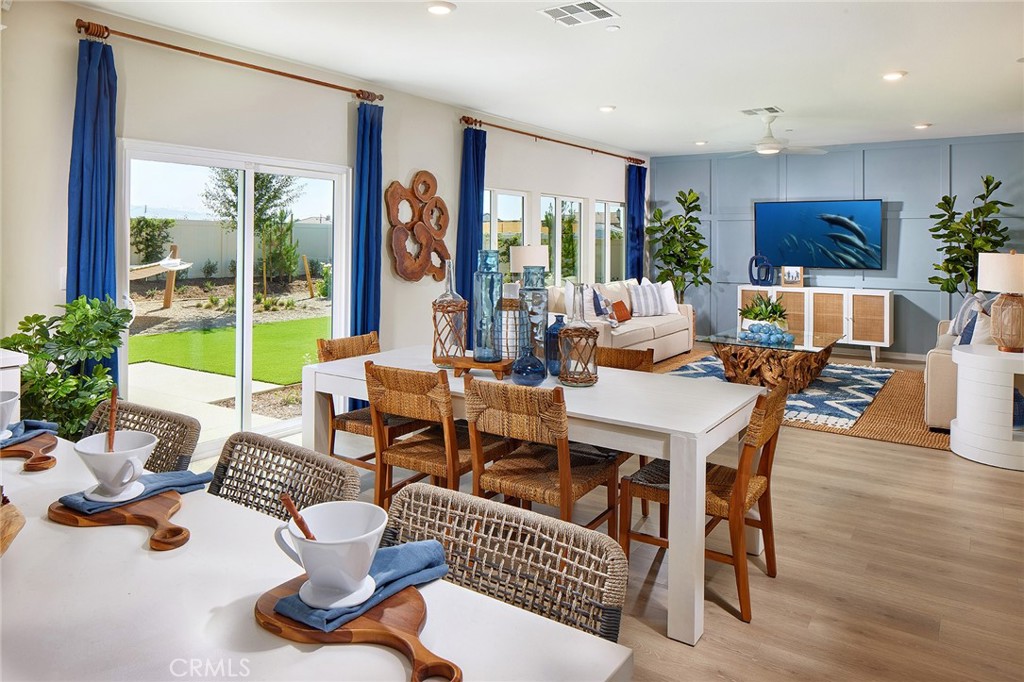 2090 El Nido Avenue Perris, CA 92571 - Photo 4 of 19 a living room with furniture and a large window