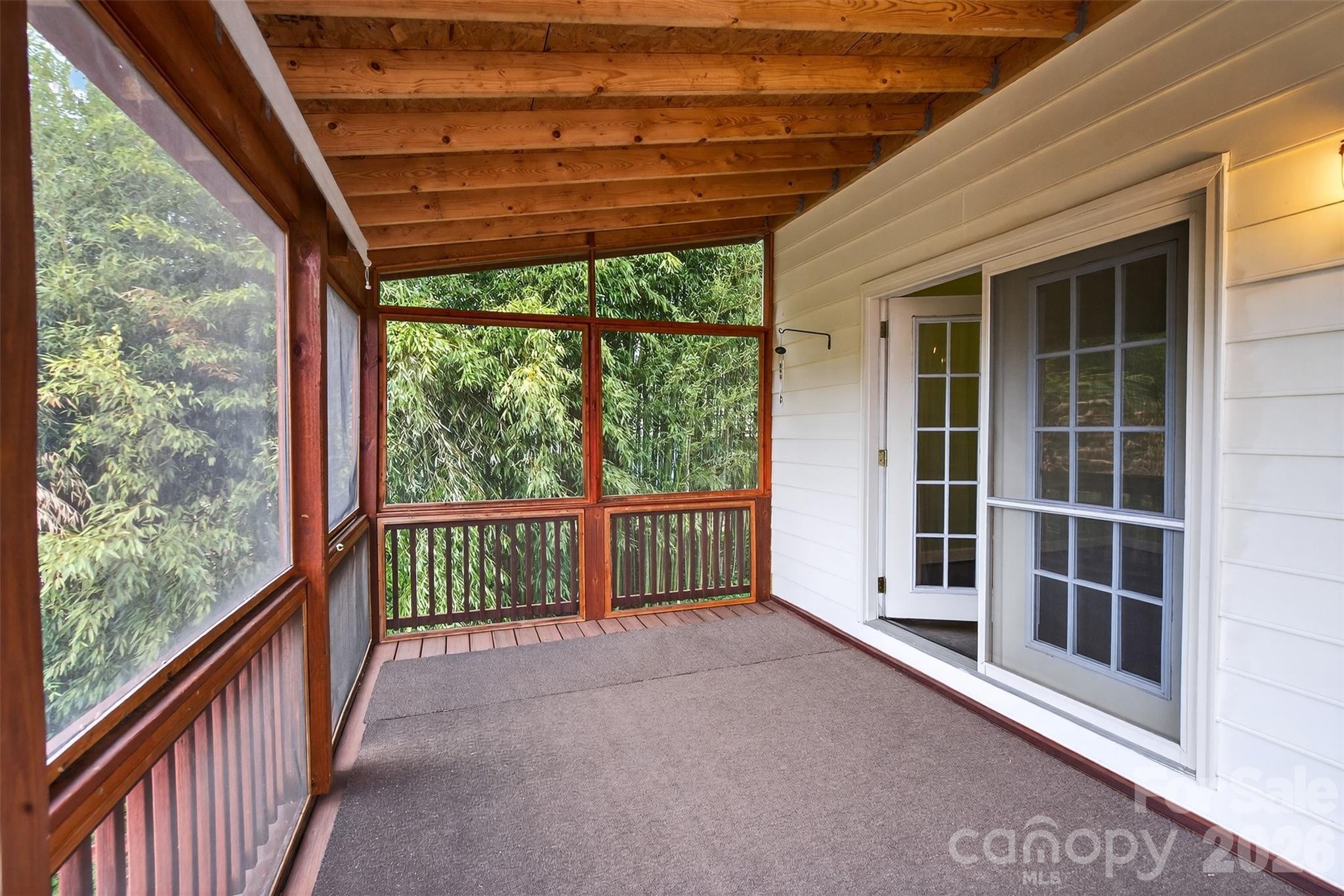 56 Whitney Avenue Tryon, NC 28782 - Photo 13 of 35 a view of a porch with a backyard