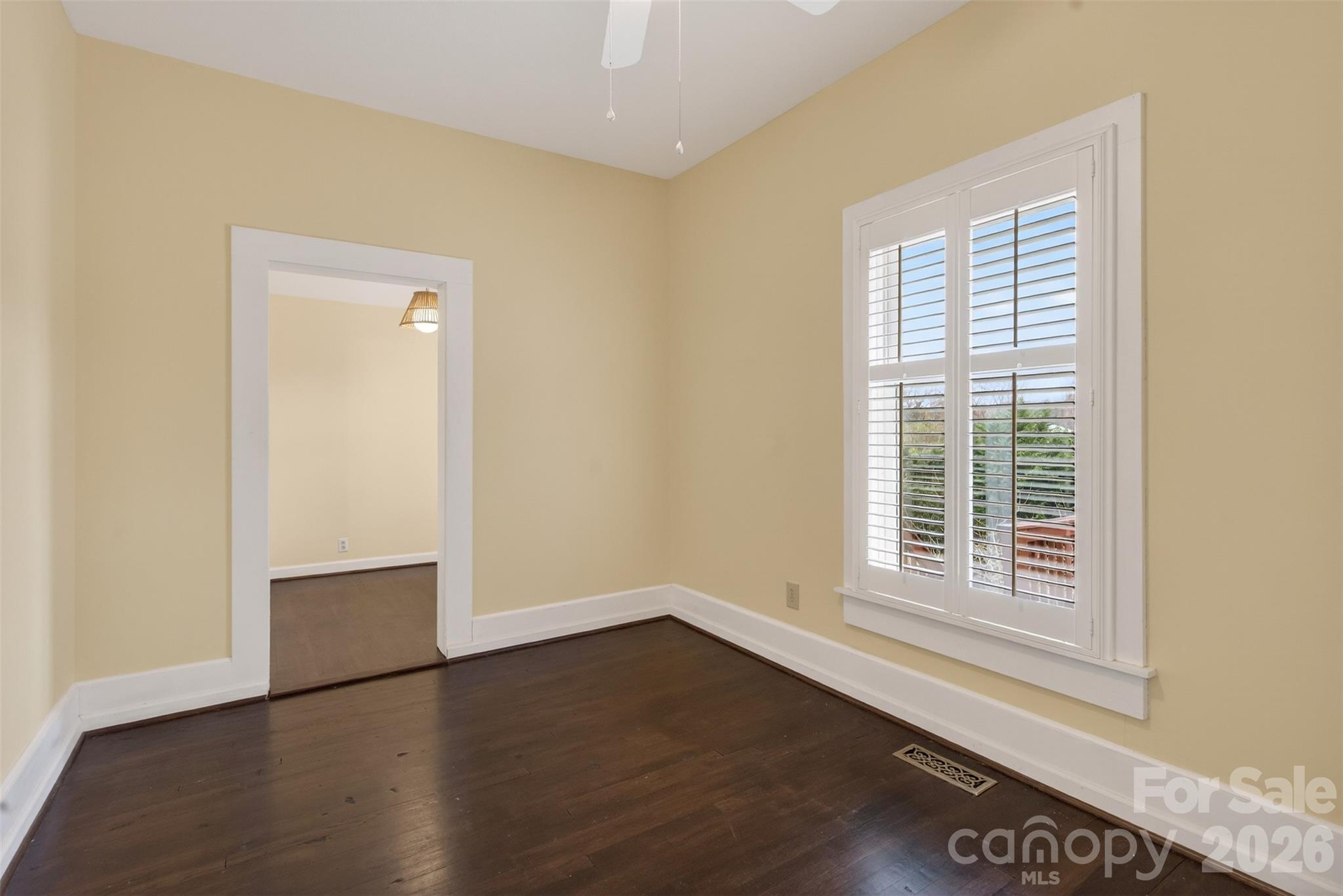 56 Whitney Avenue Tryon, NC 28782 - Photo 20 of 35 an empty room with wooden floor and windows