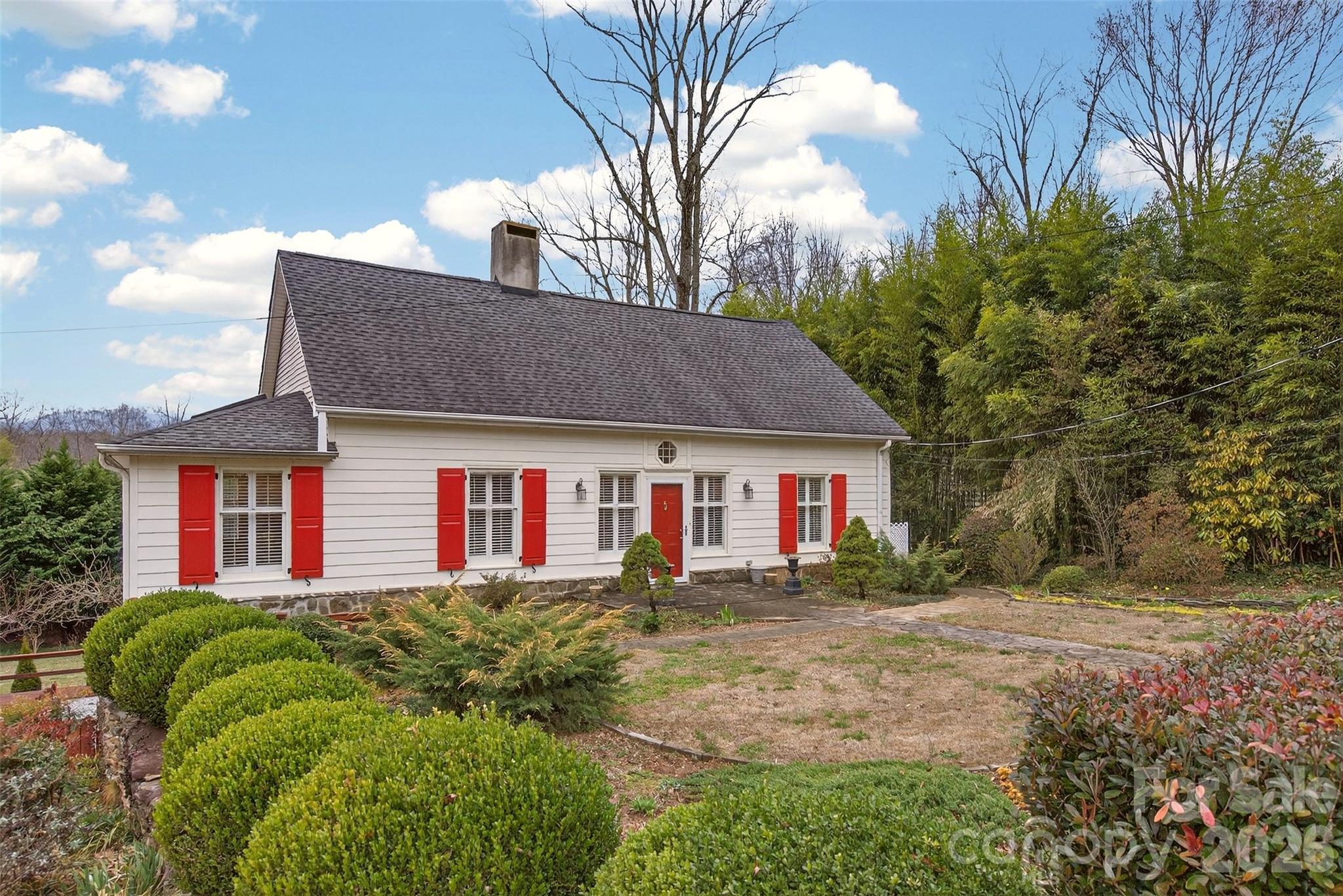 56 Whitney Avenue Tryon, NC 28782 - Photo 2 of 35 a house view with a outdoor space