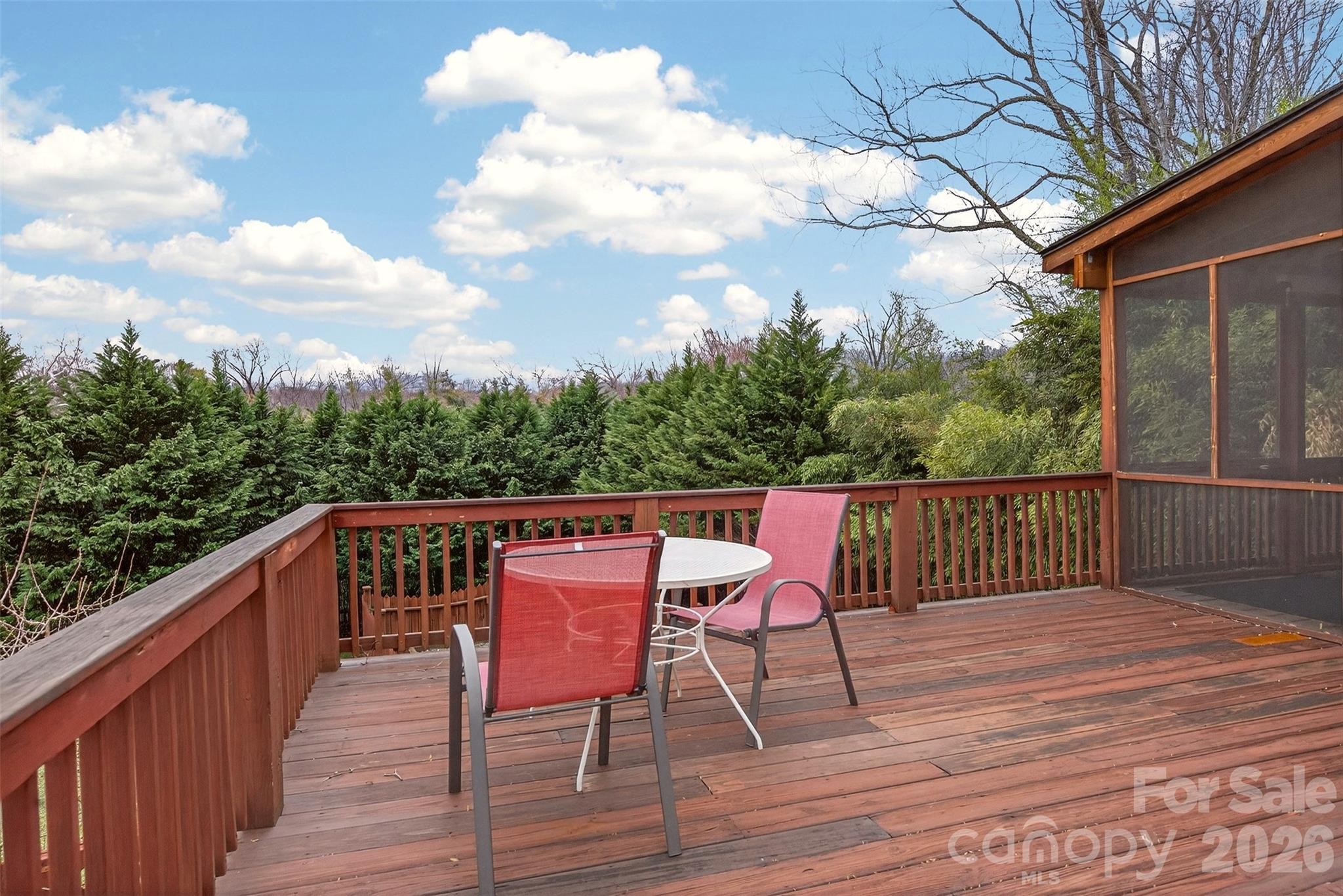 56 Whitney Avenue Tryon, NC 28782 - Photo 23 of 35 a balcony with wooden floor and outdoor seating