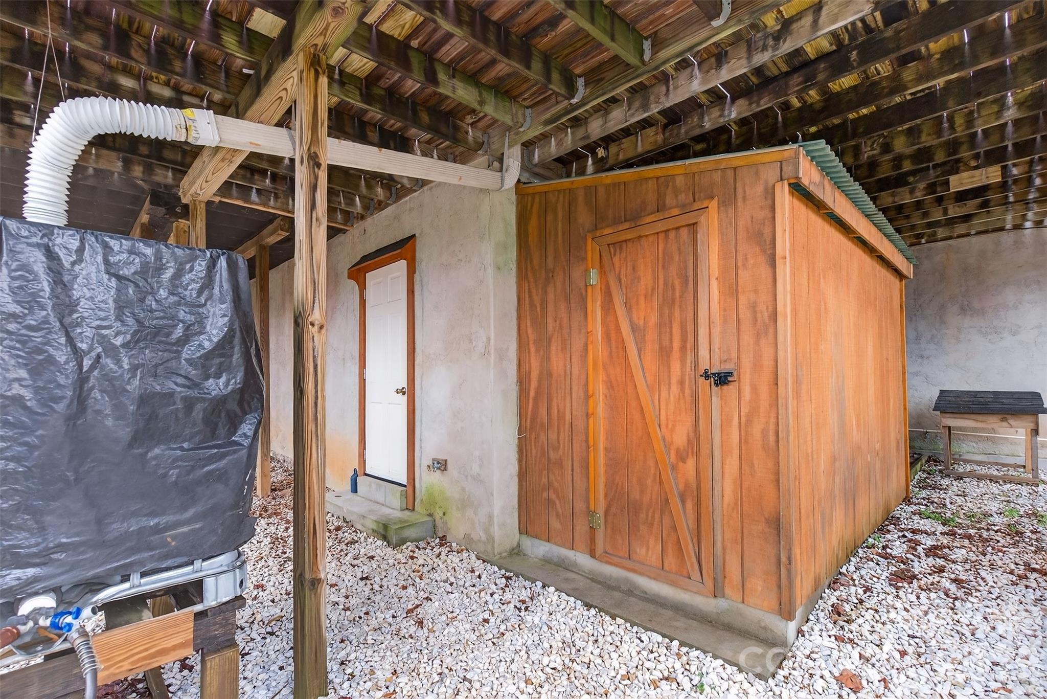 56 Whitney Avenue Tryon, NC 28782 - Photo 25 of 35 a view of a house with a wooden door