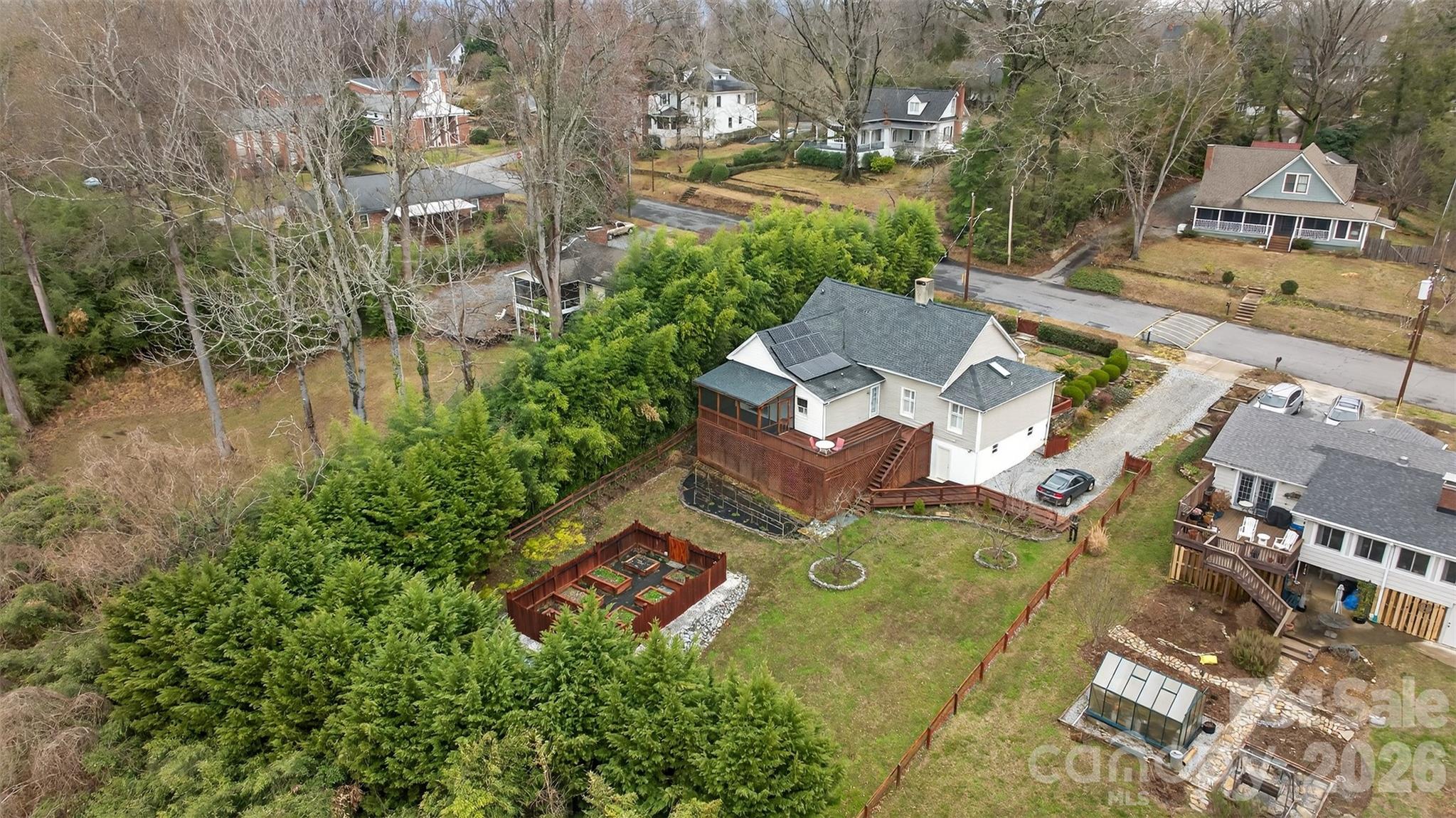 56 Whitney Avenue Tryon, NC 28782 - Photo 28 of 35 an aerial view of a house with outdoor space and trees all around