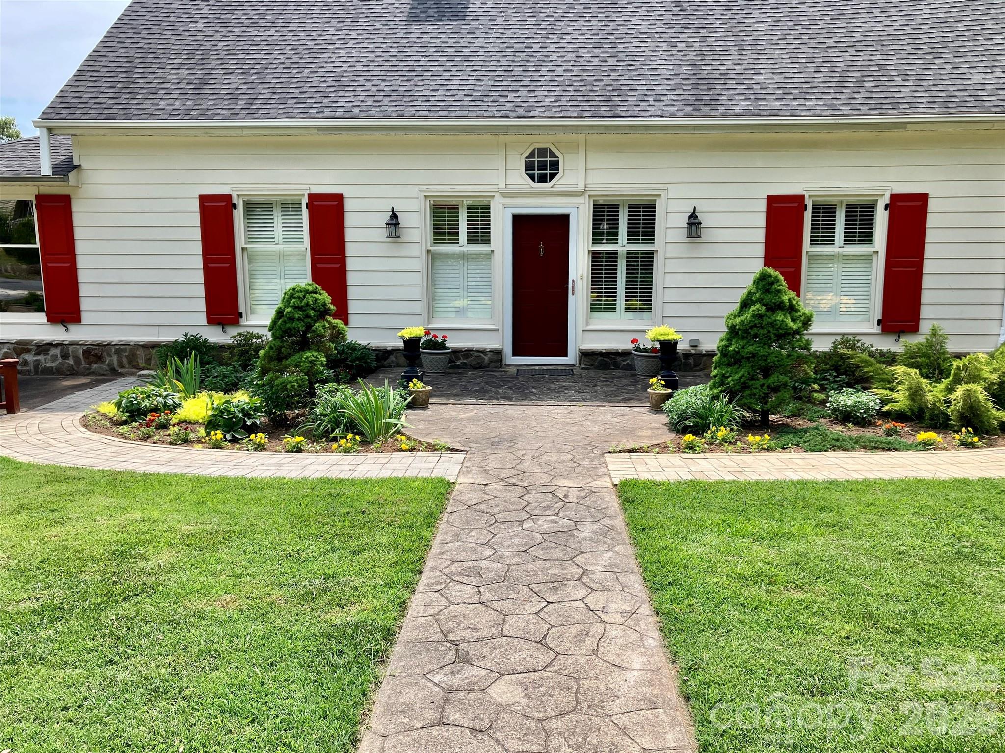56 Whitney Avenue Tryon, NC 28782 - Photo 31 of 35 a front view of a house with garden