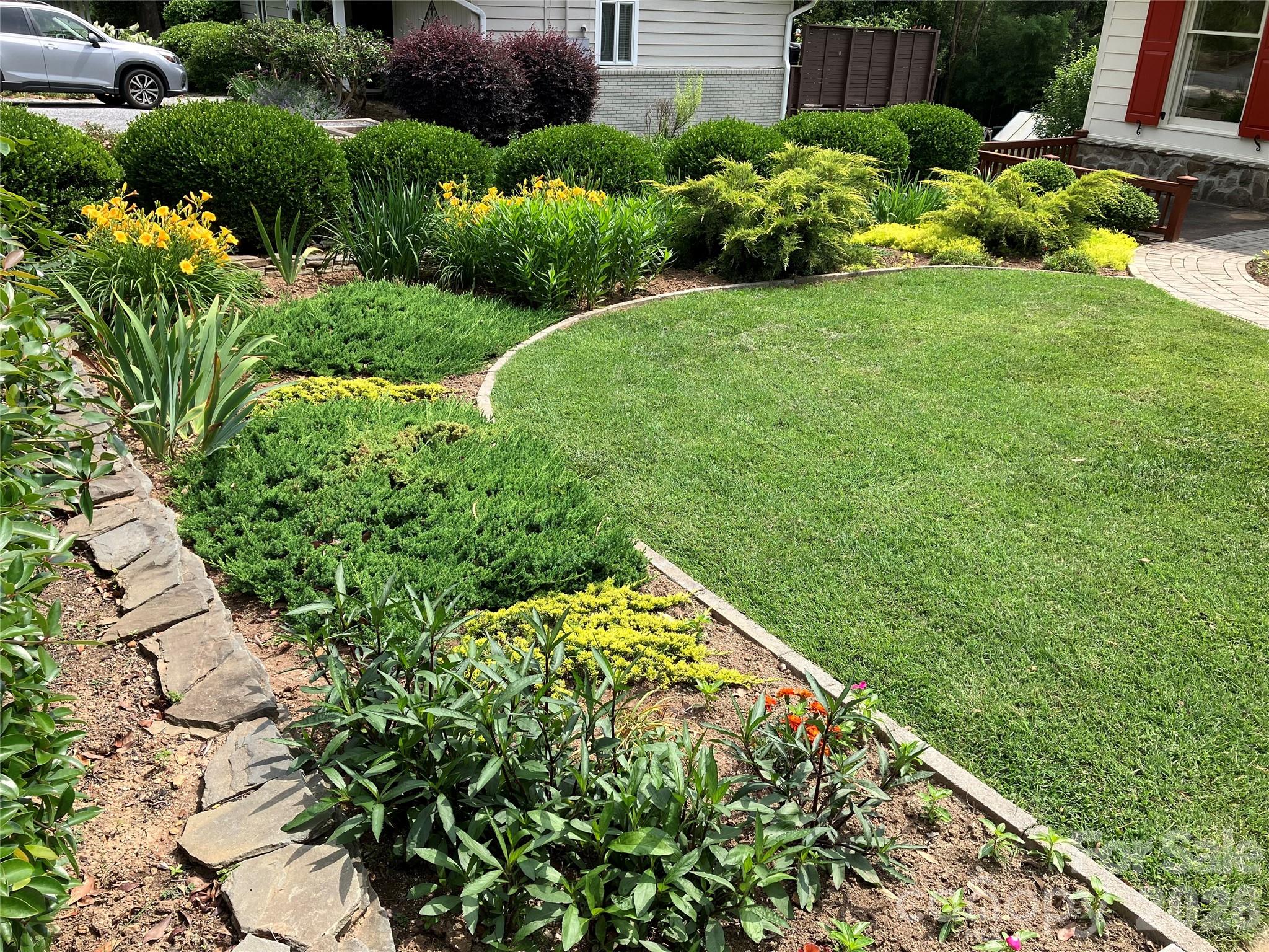 56 Whitney Avenue Tryon, NC 28782 - Photo 32 of 35 a view of a garden with a flower garden