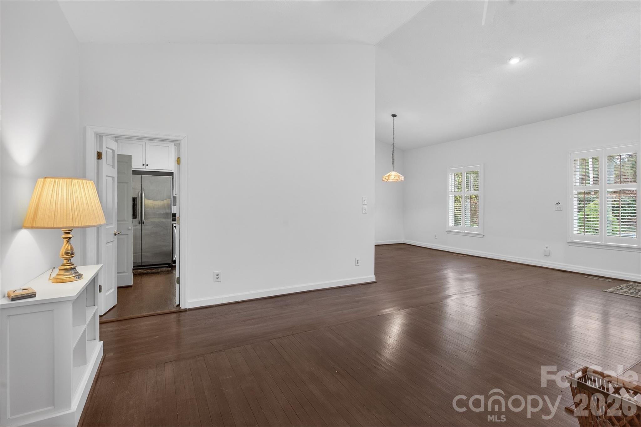 56 Whitney Avenue Tryon, NC 28782 - Photo 8 of 35 wooden floor in an empty room with a window