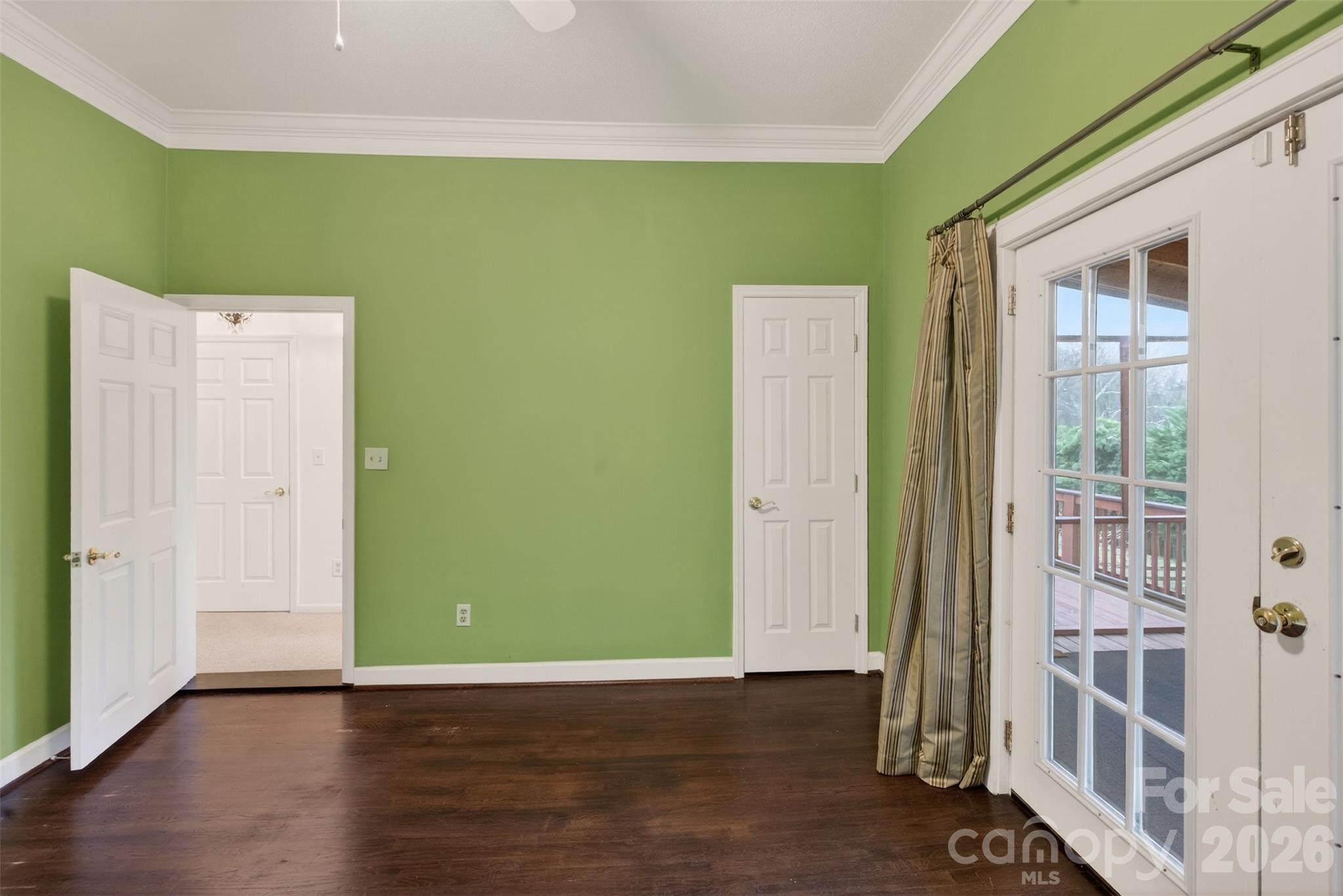 56 Whitney Avenue Tryon, NC 28782 - Photo 10 of 35 a view of an empty room with wooden floor and a window