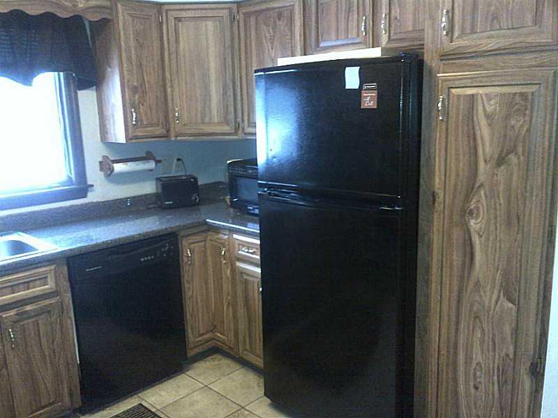 2995 Tuscarawas Road Beaver, PA 15009 - Photo 11 of 15 Kitchen. Another Angle of the Kitchen* Rich Black Appliances Offer a Nice Contrast With the Kitchen Cabinets !!