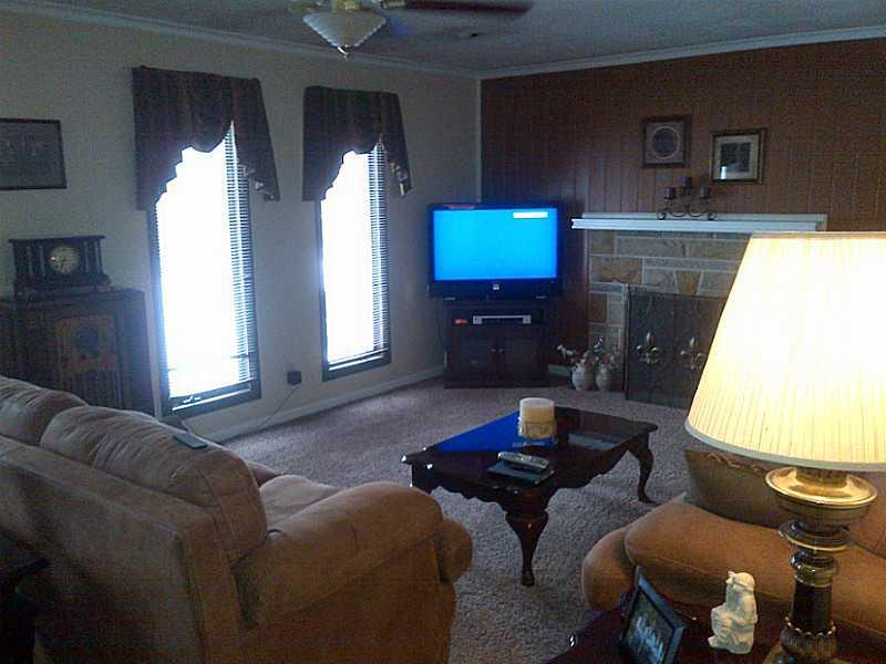 2995 Tuscarawas Road Beaver, PA 15009 - Photo 4 of 15 Living Room. Custom Windows That Allow Lots of Light* Wood Burning Fireplace for Keeping Toasty*Newer & Neutral Carpeting*