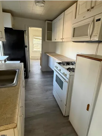 a bathroom with a toilet and a mirror