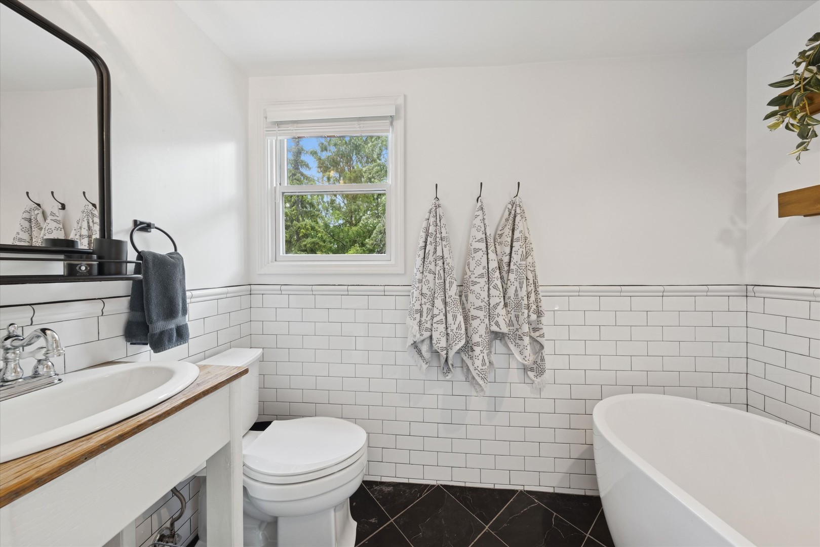 561 North County Line Road Hinsdale, IL 60521 - Photo 19 of 30 a bathroom with a sink toilet and shower