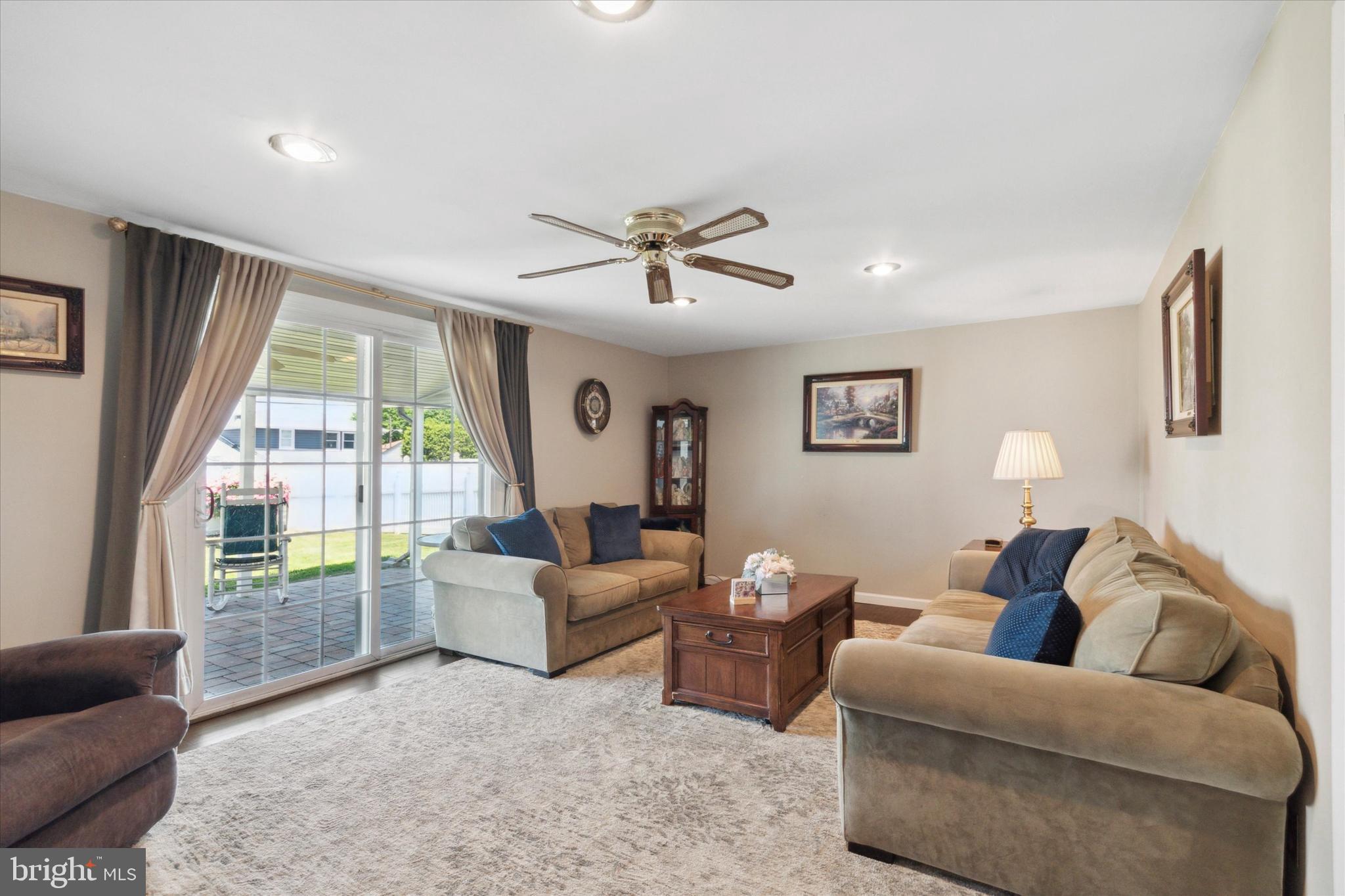 9720 Beacon Road Philadelphia, PA 19115 - Photo 16 of 35 a living room with furniture and a large window