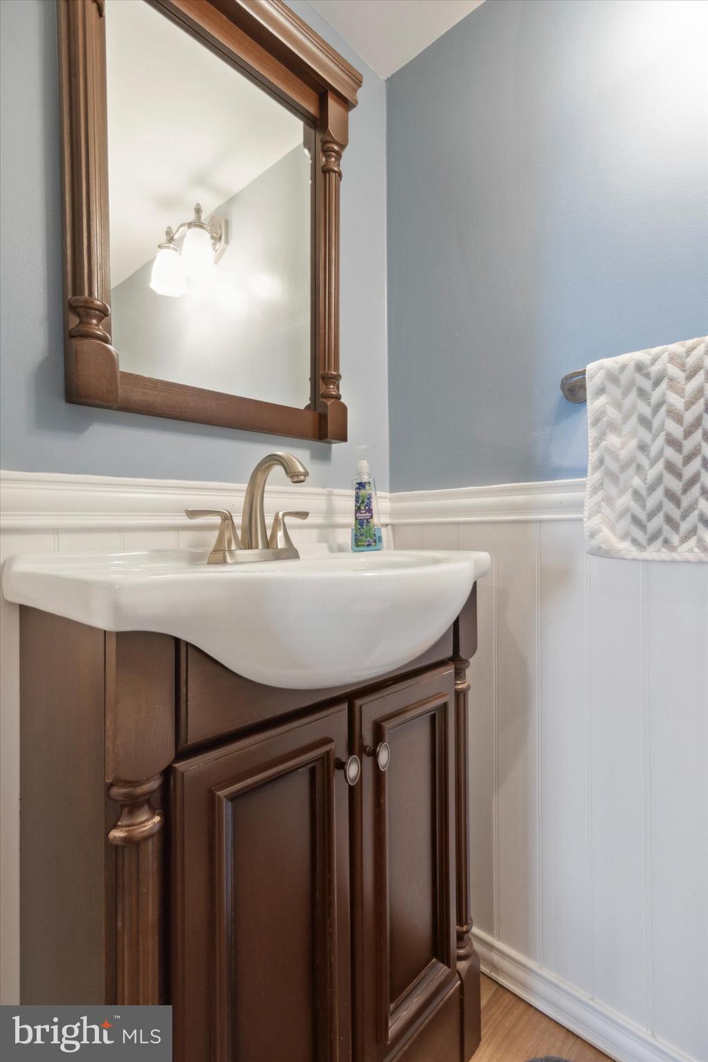9720 Beacon Road Philadelphia, PA 19115 - Photo 20 of 35 a bathroom with a sink vanity and a mirror