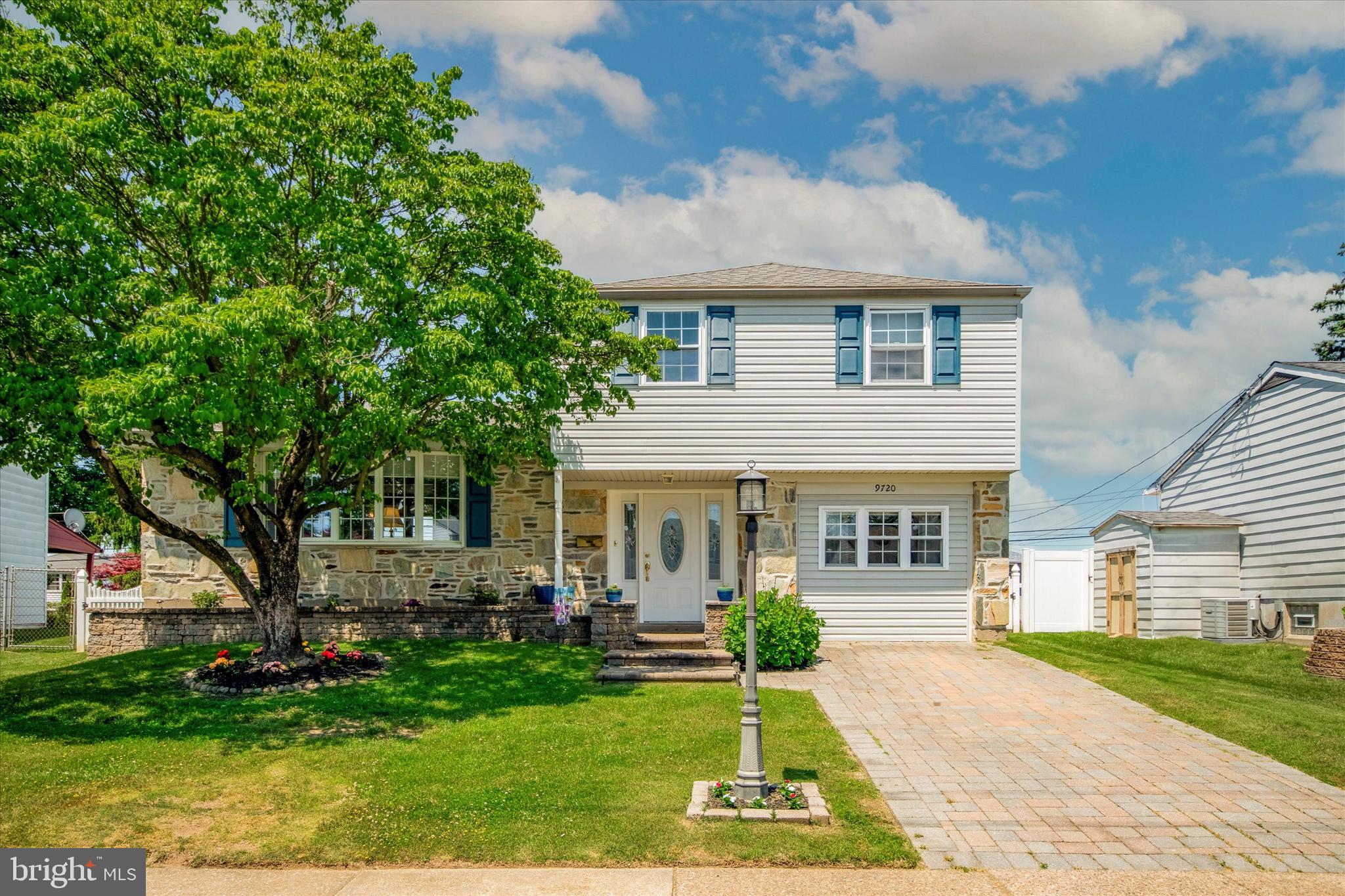 9720 Beacon Road Philadelphia, PA 19115 - Photo 2 of 35 a front view of a house with a yard