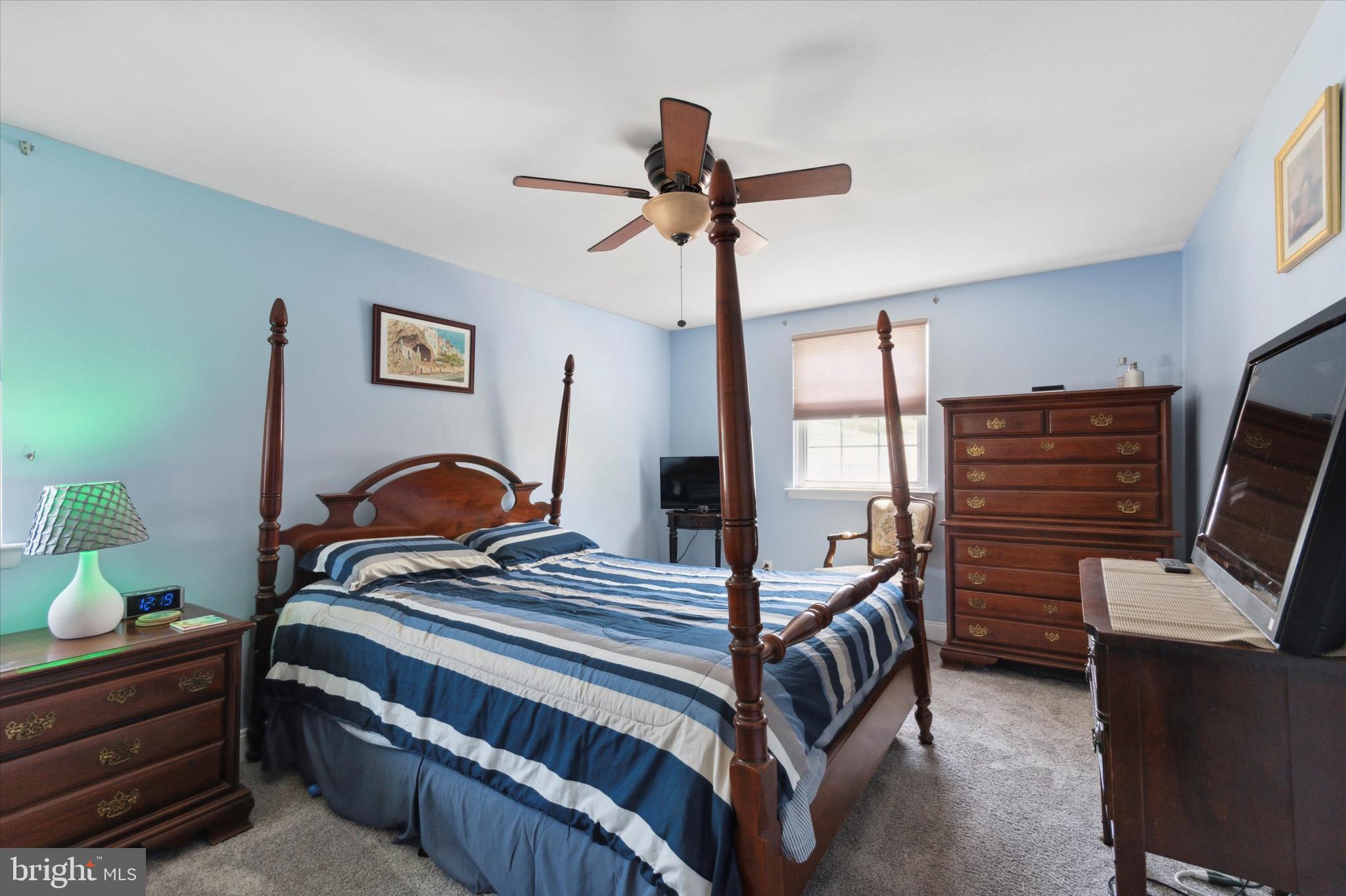 9720 Beacon Road Philadelphia, PA 19115 - Photo 26 of 35 a bedroom with a bed next to a window