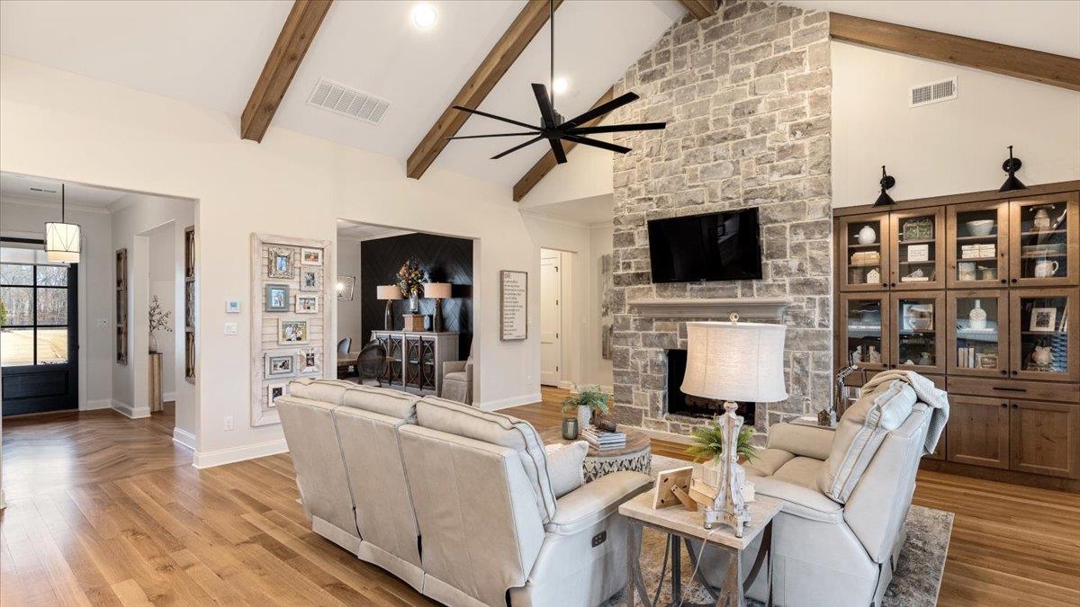 25 Jay Cove Piperton, TN 38017 - Photo 11 of 39 a living room with furniture a fireplace and a flat screen tv