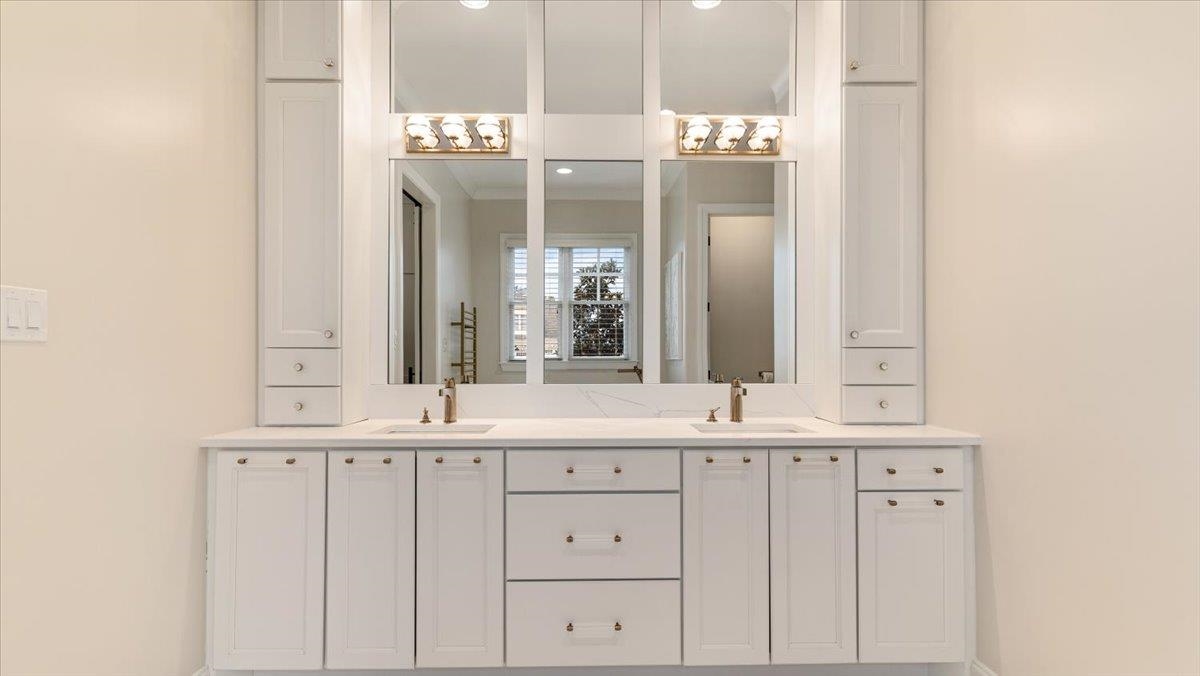 25 Jay Cove Piperton, TN 38017 - Photo 19 of 39 a bathroom with a double vanity sink and a mirror