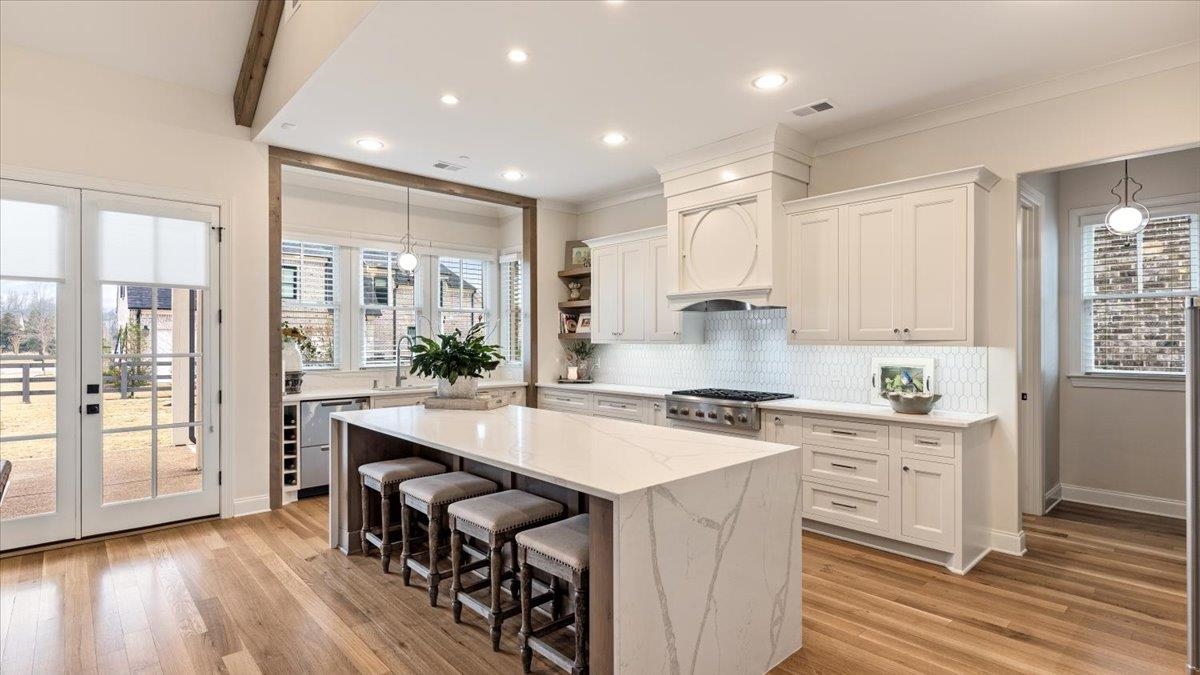 25 Jay Cove Piperton, TN 38017 - Photo 2 of 39 a kitchen with stainless steel appliances a stove a sink a refrigerator and wooden cabinets