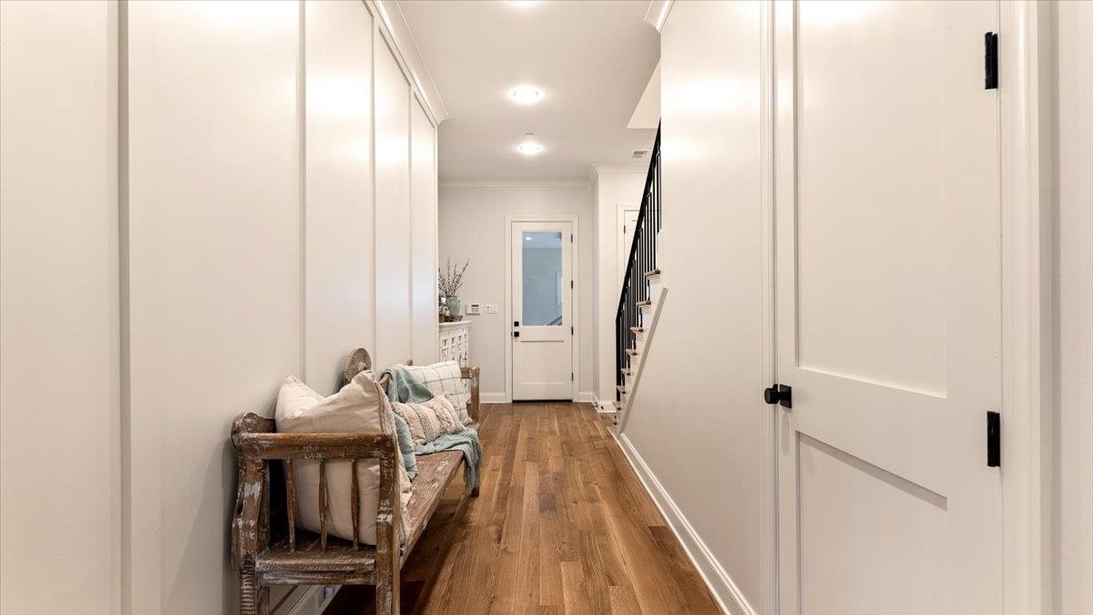 25 Jay Cove Piperton, TN 38017 - Photo 25 of 39 a view of a hallway with wooden floor and stairs