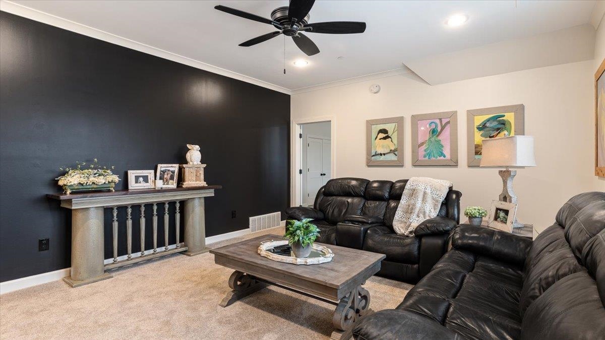 25 Jay Cove Piperton, TN 38017 - Photo 29 of 39 a living room with furniture and a wooden floor