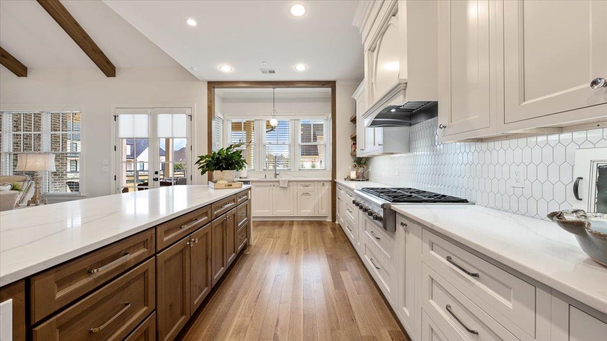 25 Jay Cove Piperton, TN 38017 - Photo 3 of 39 a large kitchen with stainless steel appliances granite countertop a lot of counter space and wooden floors