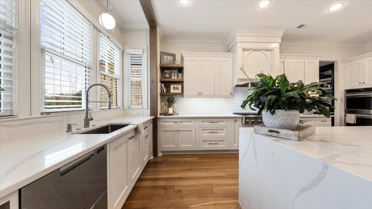 25 Jay Cove Piperton, TN 38017 - Photo 5 of 39 a kitchen with a sink stove and cabinets