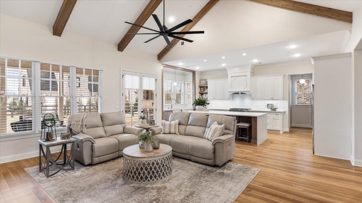 25 Jay Cove Piperton, TN 38017 - Photo 8 of 39 a living room with furniture kitchen view and a wooden floor