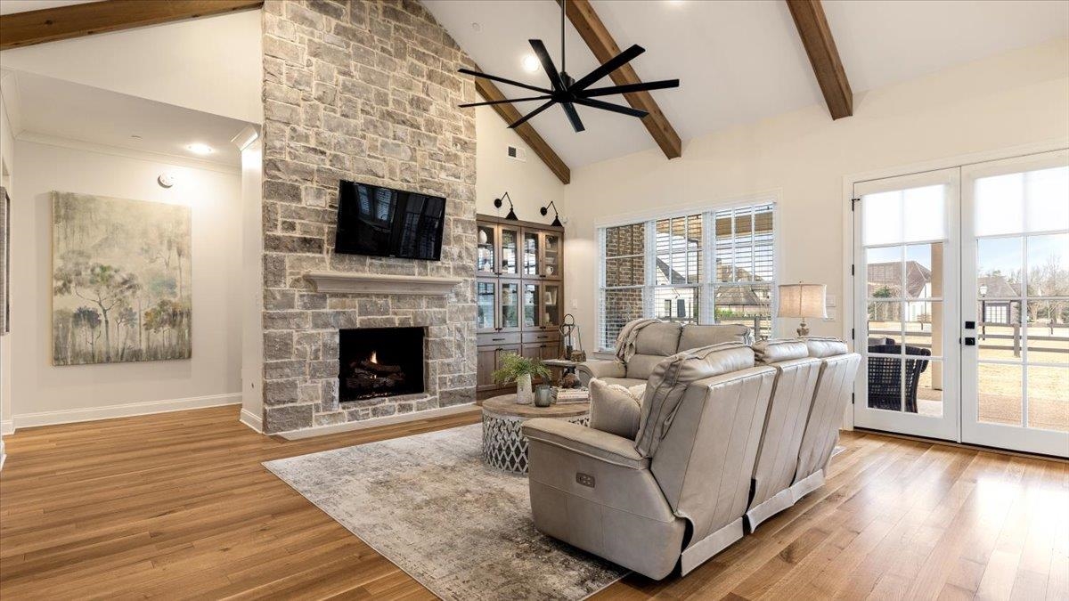 25 Jay Cove Piperton, TN 38017 - Photo 9 of 39 a living room with furniture a flat screen tv and a fireplace